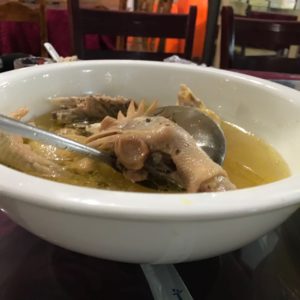 chicken soup with a chicken head